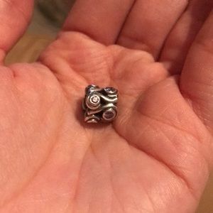 Pandora swirls with purple stones